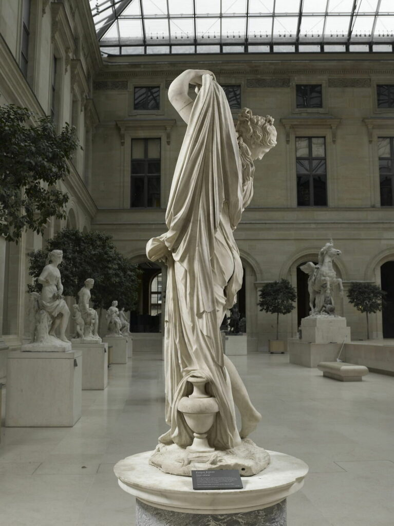 The Venus Callipyge, an ancient Greek statue of a woman lifting her robe to admire her own form, representing the word Callipygian—meaning beautifully shaped buttocks.